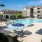 Resort-style swimming pool with lounge seating