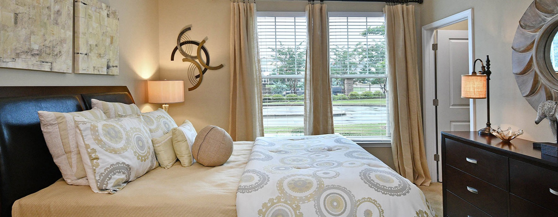 Large bedroom with large window for plenty of natural lighting at The Vinings at Laurel Creek Apartments